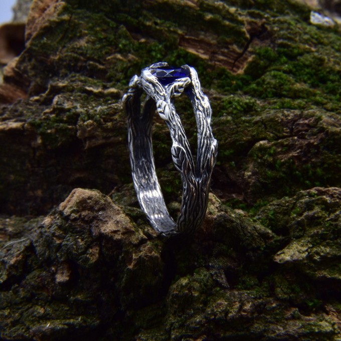 Delicate Silver Band Featuring a Blue Sapphire Gemstone