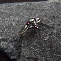 Gothic Silver Ring with Skull and Ruby Design