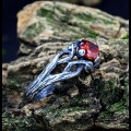 Gothic Ring with Garnet and Twisted Silver Design