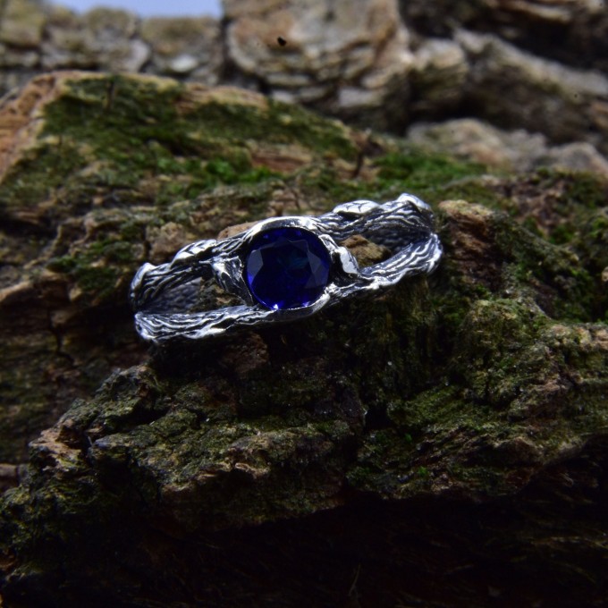 Delicate Silver Band Featuring a Blue Sapphire Gemstone