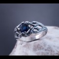 Intricate Silver Ring with Sapphire and Nature Motif