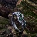Silver Ring with Emeralds and Intricate Leaf Motif