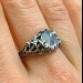 Gothic Moonstone Ring with Intricate Forest Design