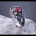 Garnet Bloom: Sterling Silver Ring with a Radiant Scarlet Gem