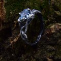 Elegant Silver Ring with Twisting Vines and Emerald Gemstone