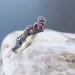 Gothic Ruby Ring with Intricate Twisting Design