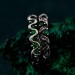 Gothic Silver Ring with Serpent and Emerald Design
