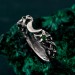 Gothic Silver Ring with Emerald and Sunburst Motif