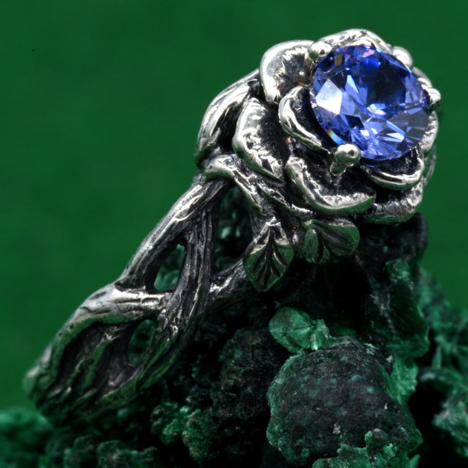 Enchanting Floral Sterling Silver Ring with Blue Sapphire Glow